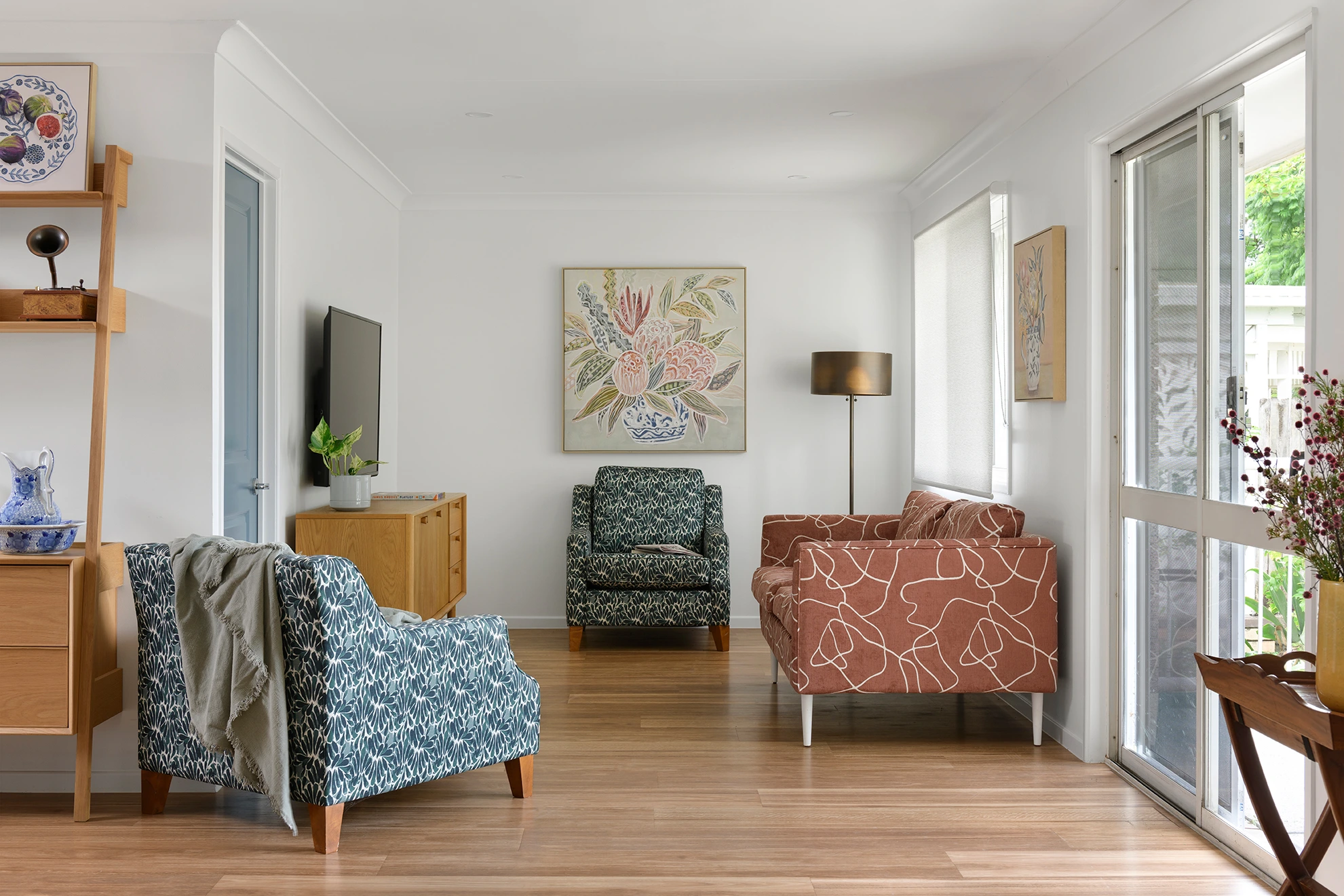 Room with chairs and tv alt text.