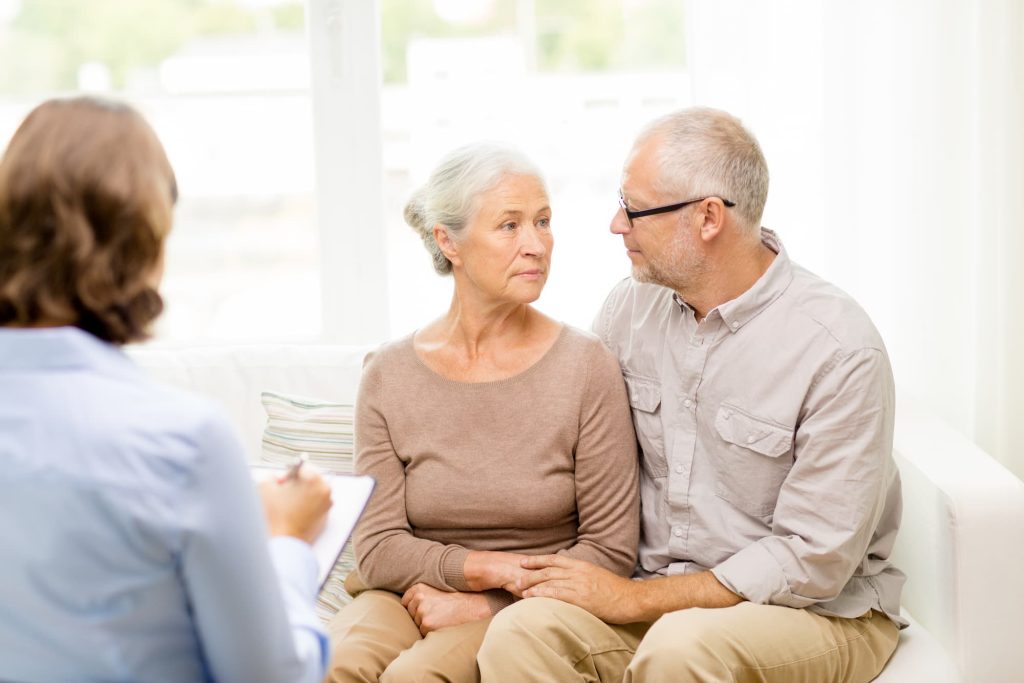 Elderly couple being counselled.