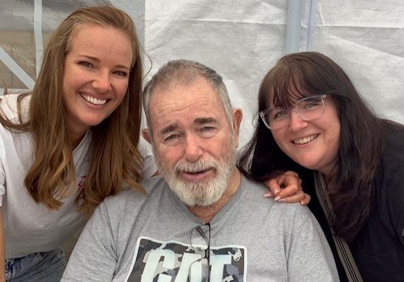 Norman with 2 daughters 3-min Norman